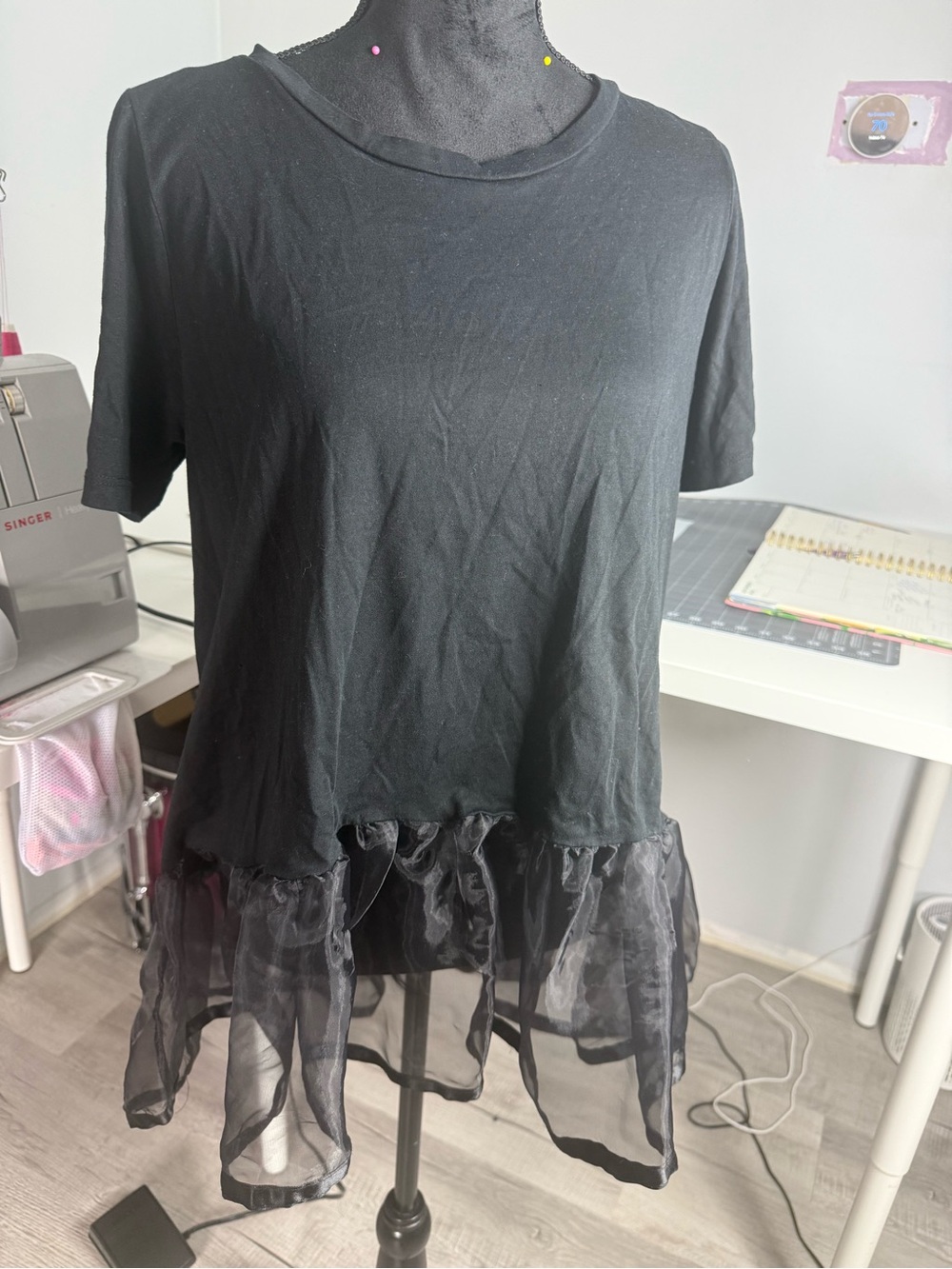 Black Women's Short Sleeve Top with Sheer Ruffle Hem